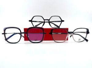 Lunettes Jean François Rey, trio de montures acétate coloris noir pailleté, chez Optique Place des Fêtes opticien à Paris 19