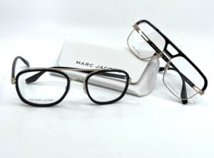 Deux lunettes Marc Jacobs hommes, acétate noire et métal doré à double pont